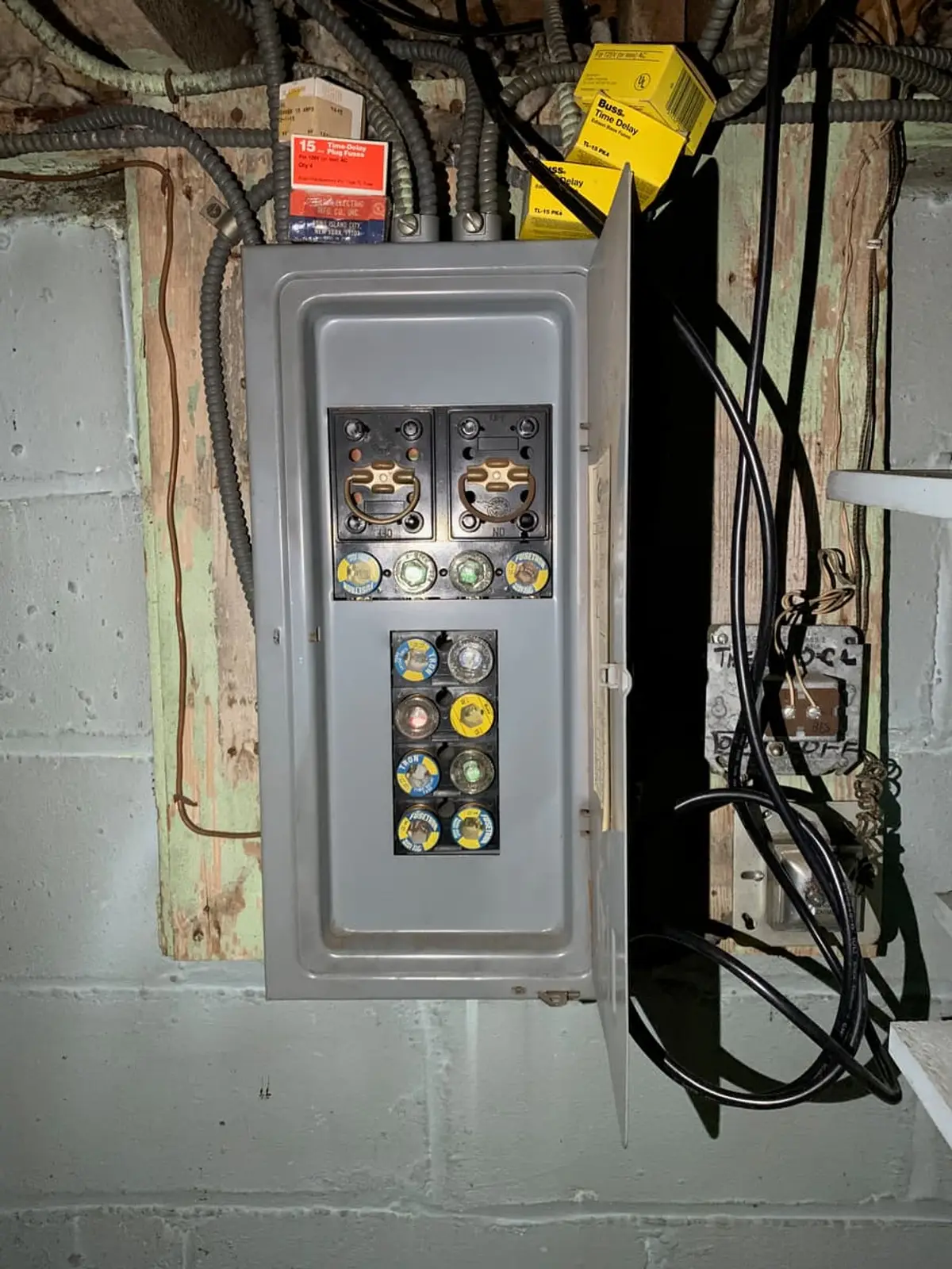 Selling a house with code violations in Valley Stream: old fuse box with screw-in fuses